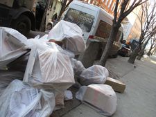 7000 Oaks in New York City with recycling waiting to be picked up by sanitation.